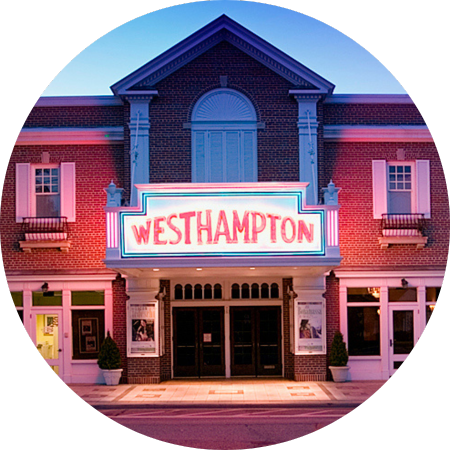 The Westhampton Beach Performing Arts Center lit up at dusk.