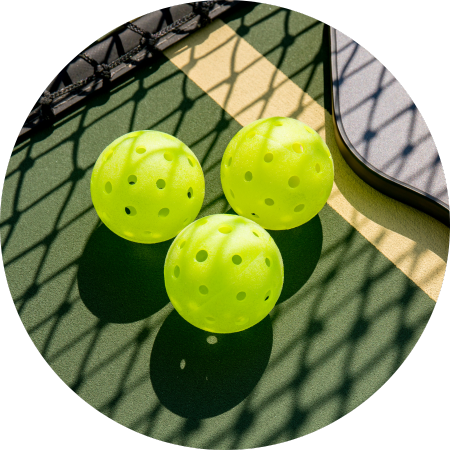 Pickleballs on the court.